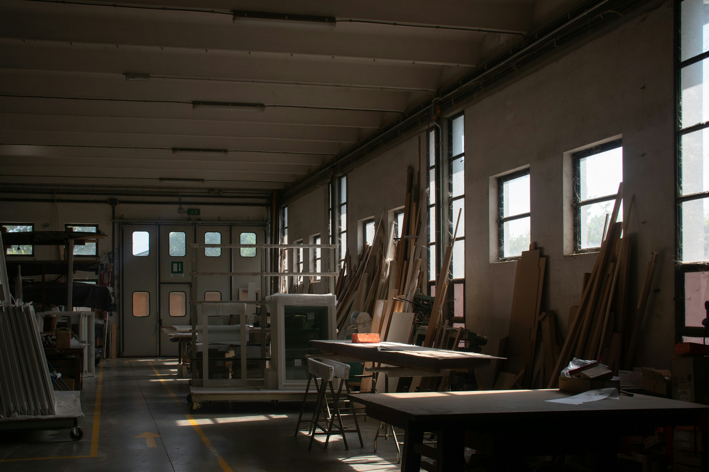 Woodworking workshop with timber and workbenches